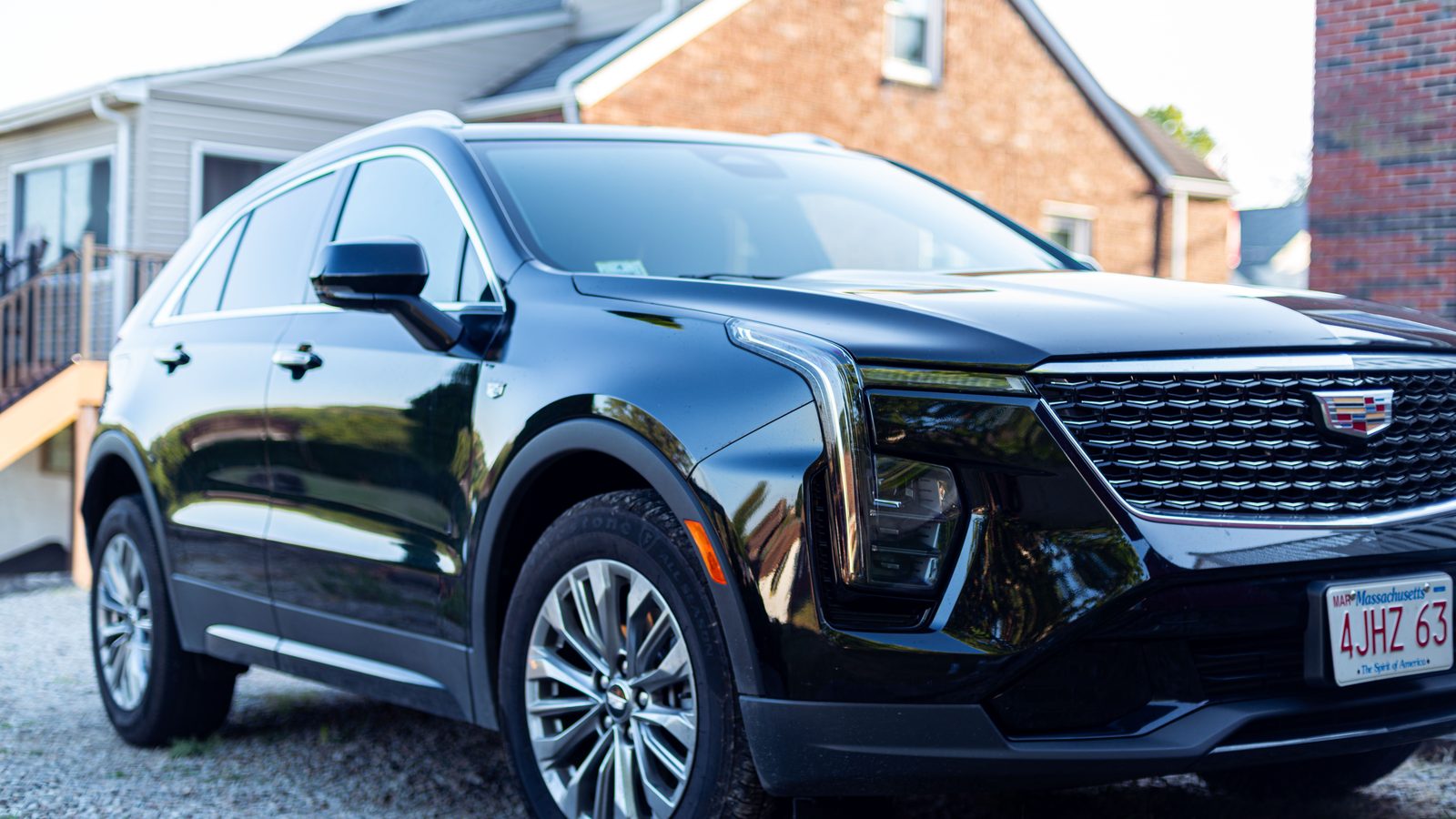 Luxury SUV parked beside a private jet on the ramp