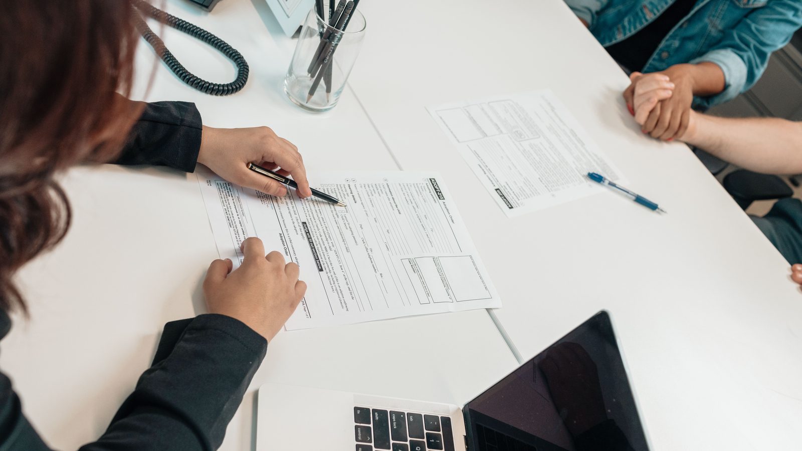 Travel agency consultant completing a partner registration form